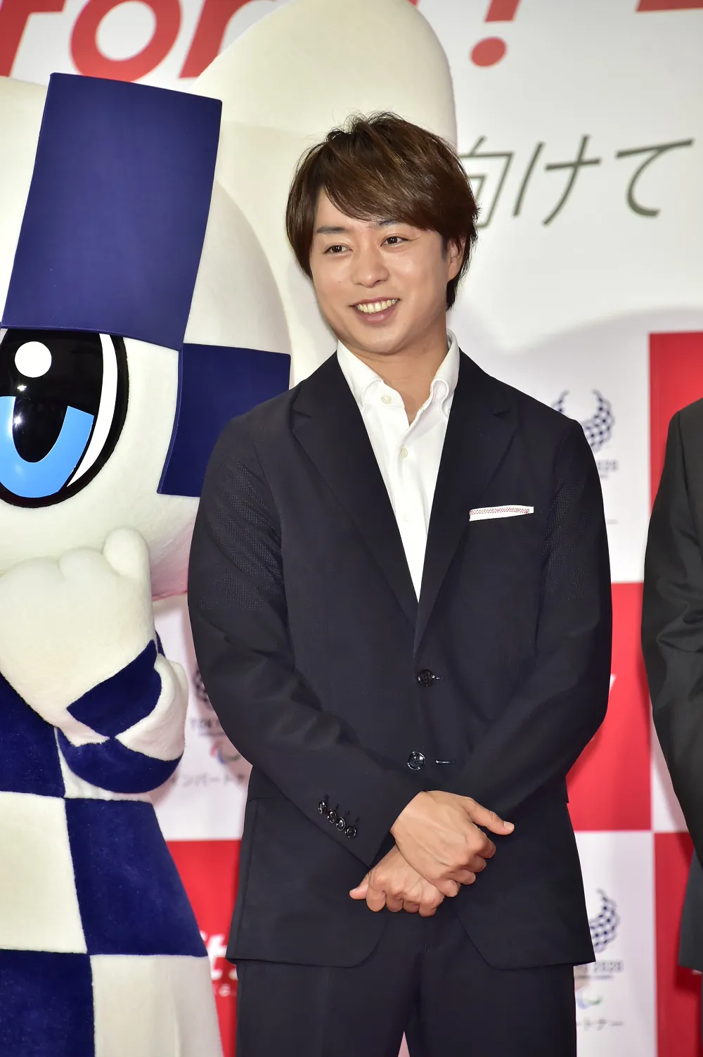 笑顔でイベントに登壇した櫻井翔