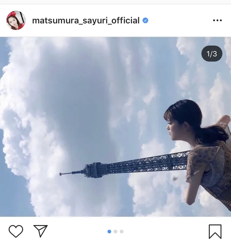 松村沙友理は「#一番にこのポーズやった日本人の自信あり」「#腰に負担がかかるので真似しないでください」とエッフェル塔を“抱えた”写真を公開